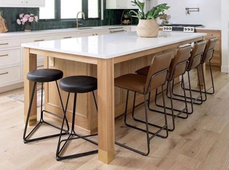 kitchen island, chairs and light oak hardwood flooring